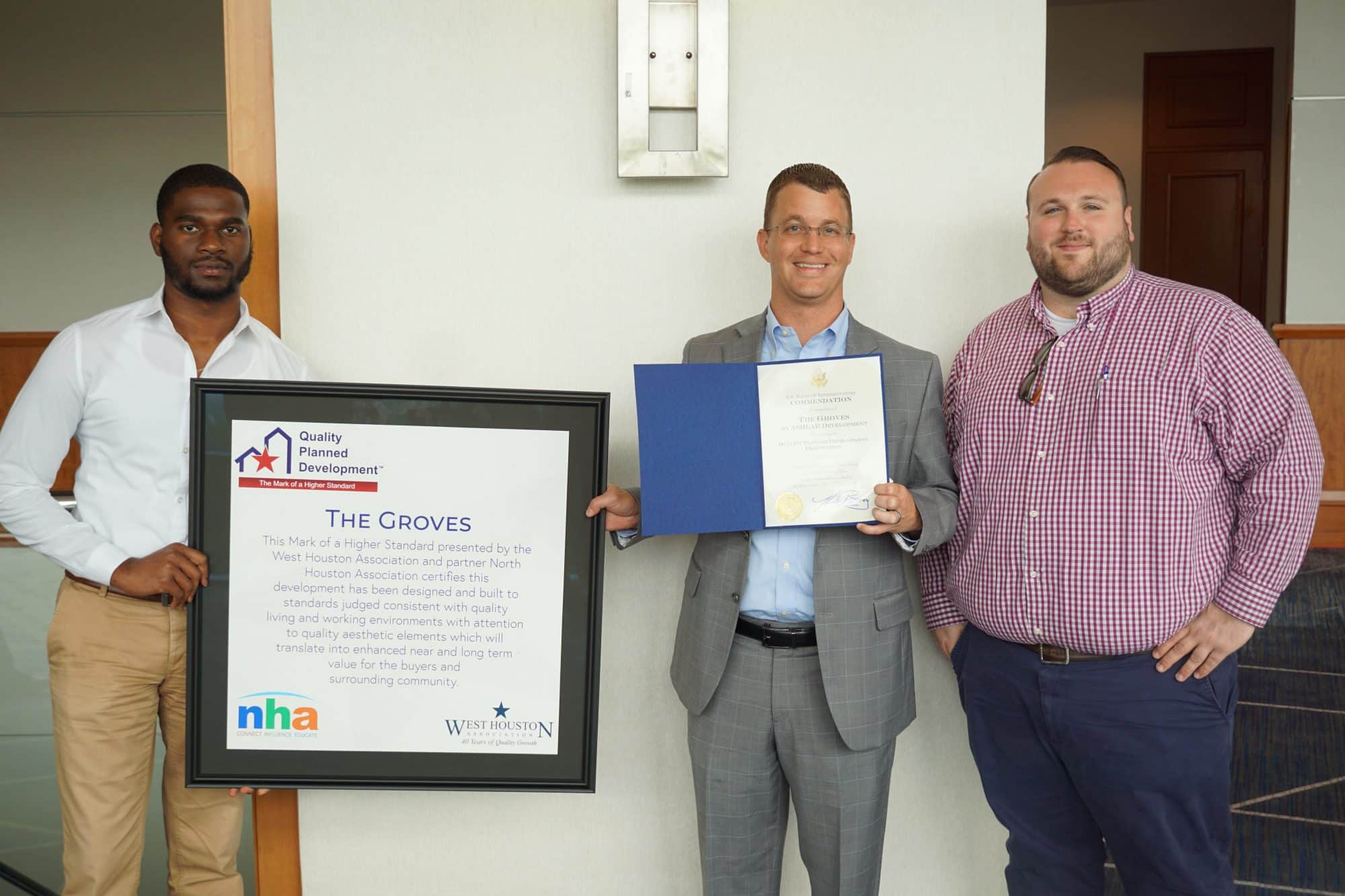 Ashlar team members Royce Brooks, Mike Miller and Brad McFarland with award